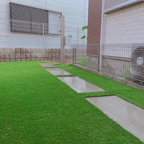 Artificial grass lawn installation in an Abu Dhabi villa garden UAE