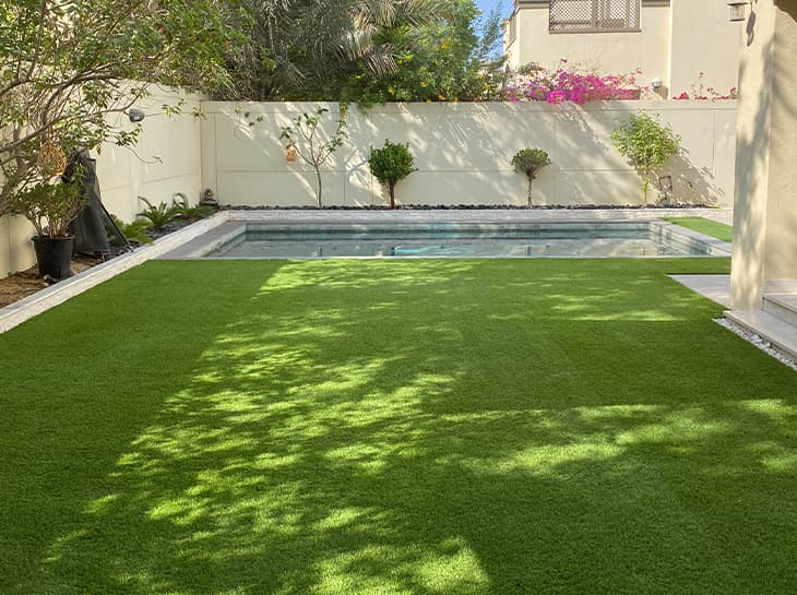 Artificial grass lawn beside a pool in Dubai